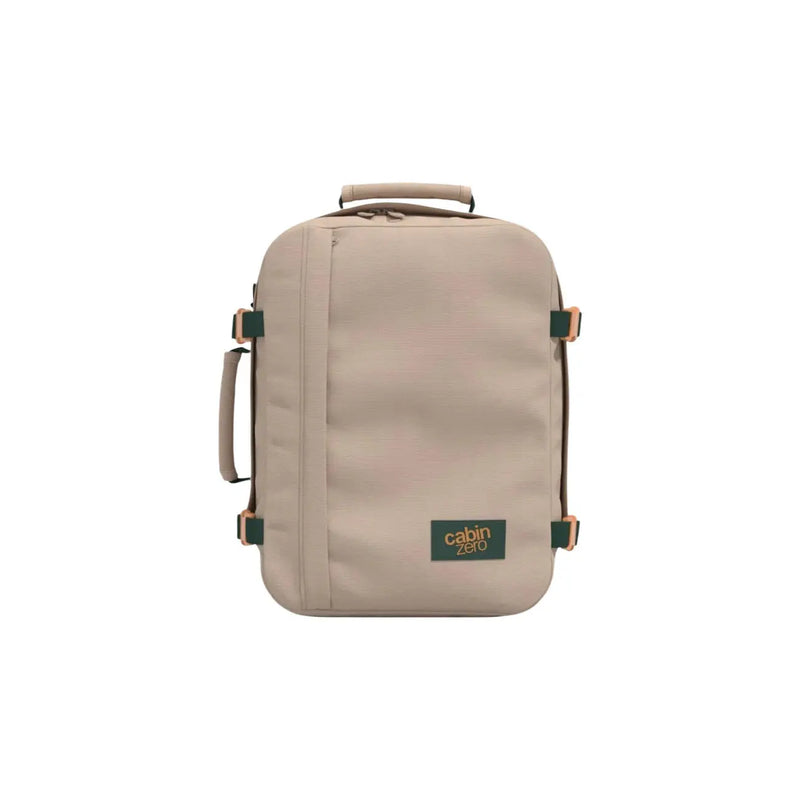 Beige Cabin Zero carry-on backpack with green accents and tan leather handles made of durable polyester