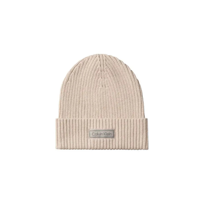 Beige calvin klein ribbed beanie with logo patch.