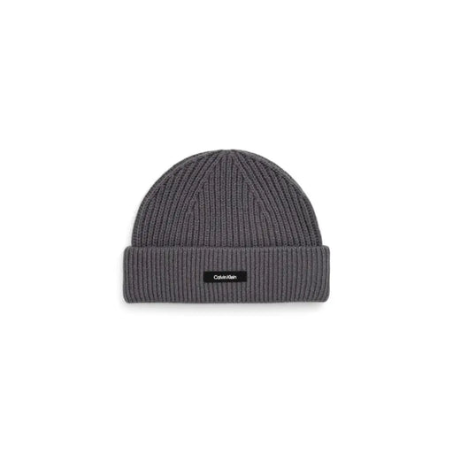 Gray calvin klein ribbed beanie with logo label.