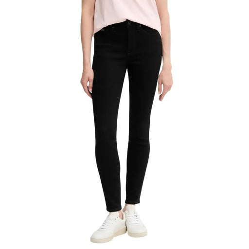 Calvin klein black cotton jeans for women featuring high-waisted skinny fit and sleek form-fitting design