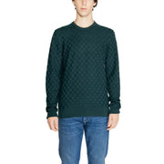Dark green textured sweater with a diamond pattern, likely made of wool or cotton.