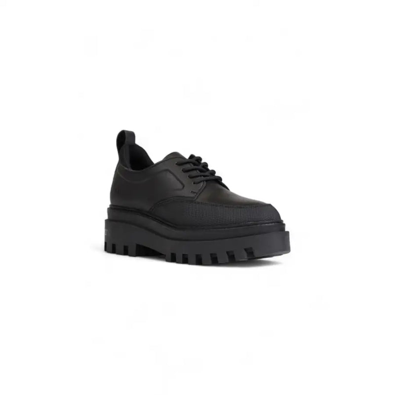 Calvin Klein black platform lace-up women’s shoe with textured upper and chunky sole for stylish wear