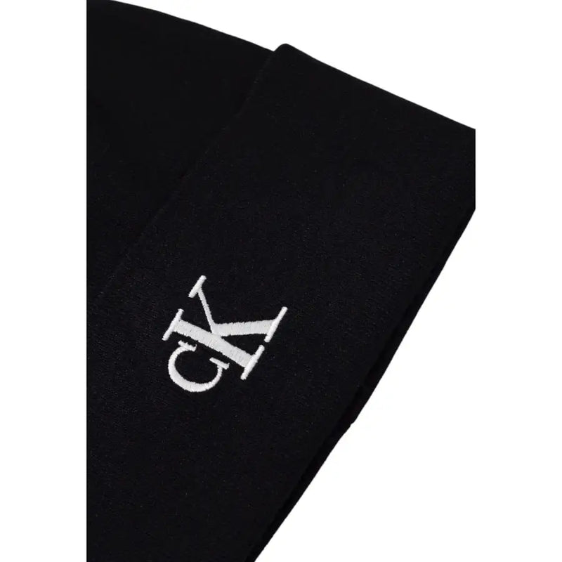 Black calvin klein ck logo t-shirt with white lettering and design.