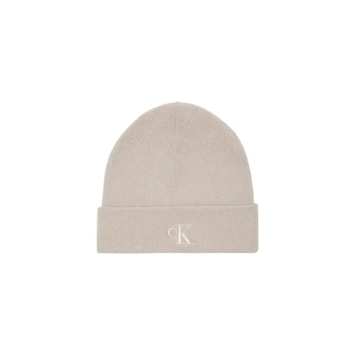 Calvin klein beige beanie with embroidered logo.