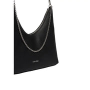 Calvin Klein black textured leather shoulder bag with silver chain strap and zip pocket for secure storage