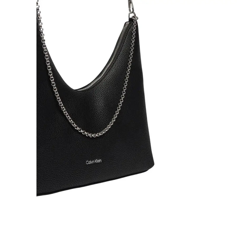 Calvin Klein black textured leather shoulder bag with silver chain strap and zip pocket for secure storage