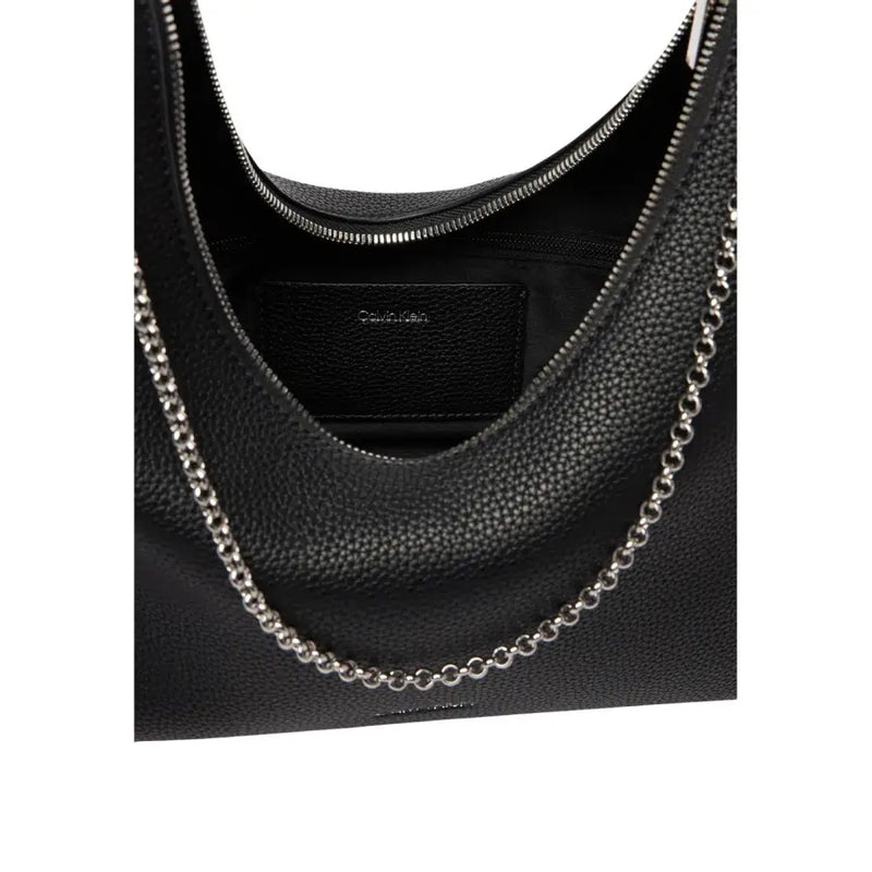 Black textured leather Calvin Klein hobo bag with silver chain strap and zip pocket for stylish daily use