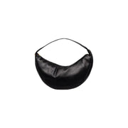 Calvin Klein black polyurethane crescent-shaped shoulder bag with zip closure and interior pockets in minimalist design