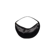 Calvin Klein black polyurethane crescent-shaped shoulder bag with zip closure and interior pockets in minimalist design