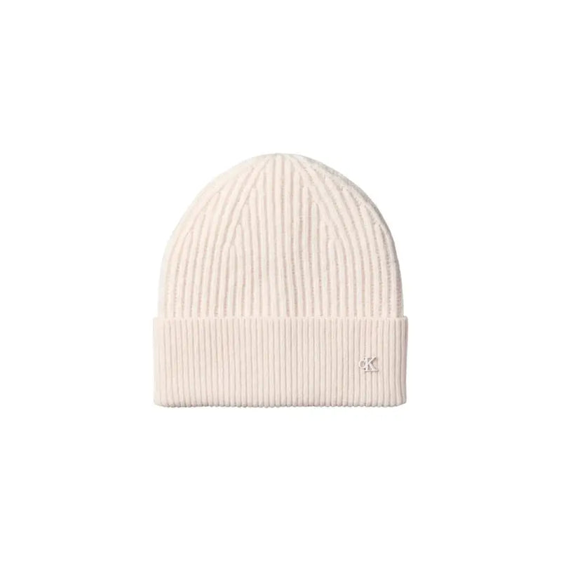 Cream-colored calvin klein ribbed beanie with logo detail.