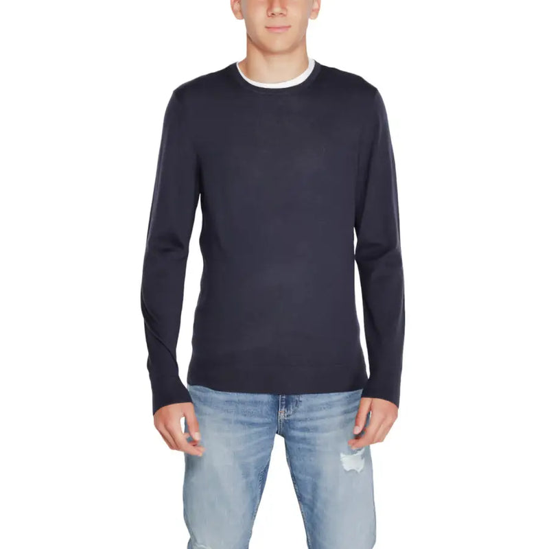 Navy blue crew neck sweater with white trim, likely made of cotton or polyester blend.
