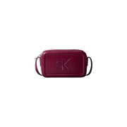Calvin Klein Bordeaux polyurethane zip bag in burgundy leather with embossed CK logo and interior pockets