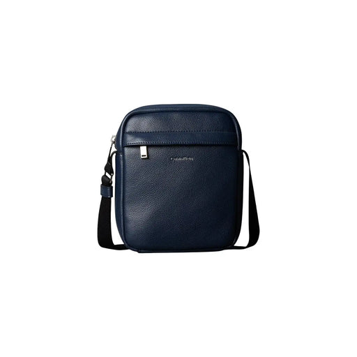 Calvin Klein crossbody bag Raised Reporter for women in navy blue textured leather with black strap and silver zipper pull, front view