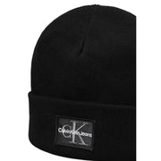 Black calvin klein jeans beanie with logo patch.