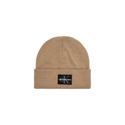 Beige calvin klein beanie with logo patch.