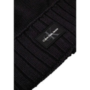 Black calvin klein ribbed knit beanie with logo patch.
