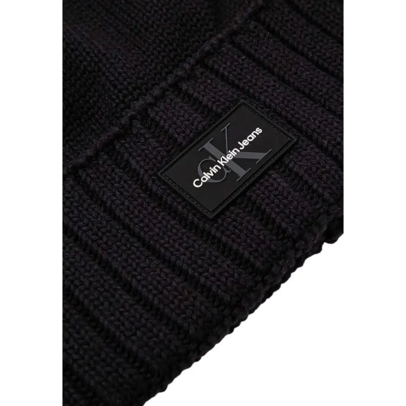 Black calvin klein ribbed knit beanie with logo patch.