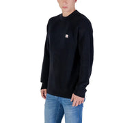 Calvin Klein Jeans black cotton ribbed knit sweater with small white logo patch on the chest