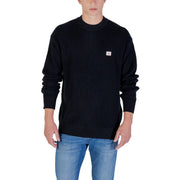 Calvin Klein Jeans black cotton ribbed knit sweater with small red and white logo patch on the left chest