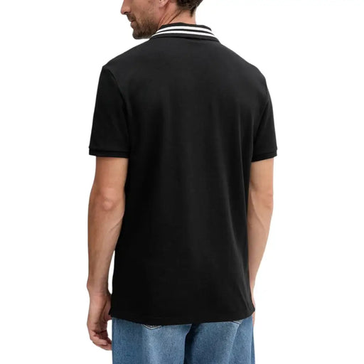Calvin Klein Jeans black cotton polo shirt for men with short sleeves and a collar featuring two white stripes