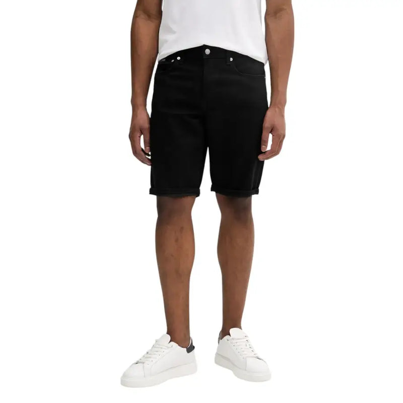 Calvin Klein Jeans black cotton stretch shorts for men featuring classic five-pocket design and rolled cuffs