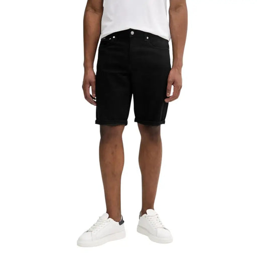 Calvin Klein Jeans black cotton stretch shorts for men featuring classic five-pocket design and rolled cuffs