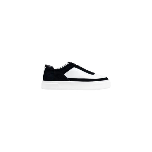 Calvin Klein Jeans black leather sneakers for men with a black and white platform design featuring suede and smooth leather panels