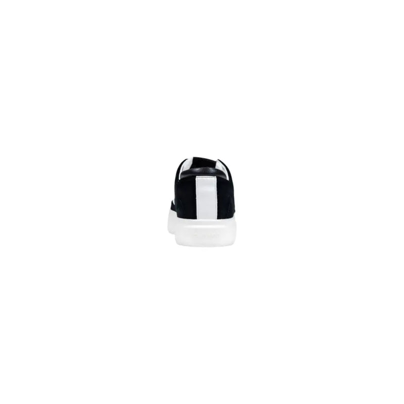 Back view of calvin klein jeans black suede sneakers for men with bold white stripe and chunky translucent sole