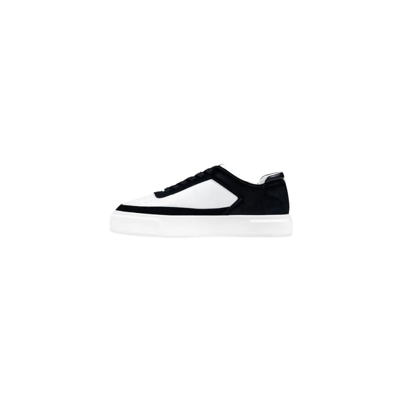 Calvin Klein Jeans black and white low-top sneakers for men with suede upper, contrasting panels, and chunky rubber sole