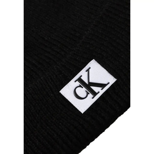 Calvin Klein Jeans black men’s ribbed knit beanie with white label and black ck logo fall winter collection