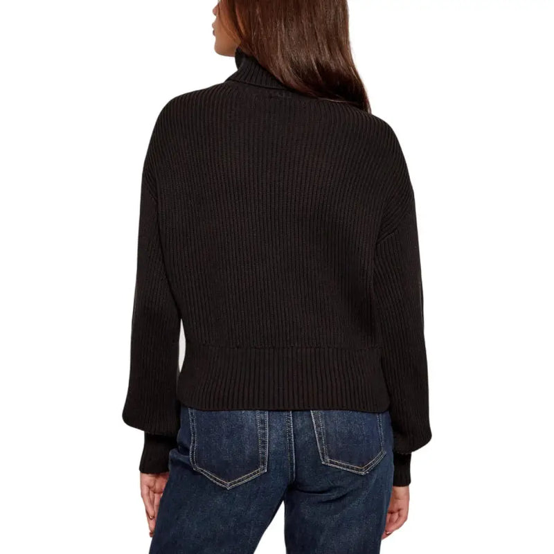 Woman wearing Calvin Klein Jeans black ribbed knit turtleneck sweater for women