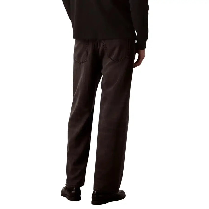 Calvin Klein jeans men baggy jeans black lyocell viscose showing back side with dark gray wide-leg relaxed fit denim