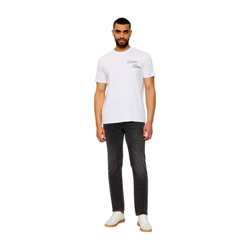 White calvin klein t-shirt with subtle black cursive logo paired with beige cotton classic fit jeans for men