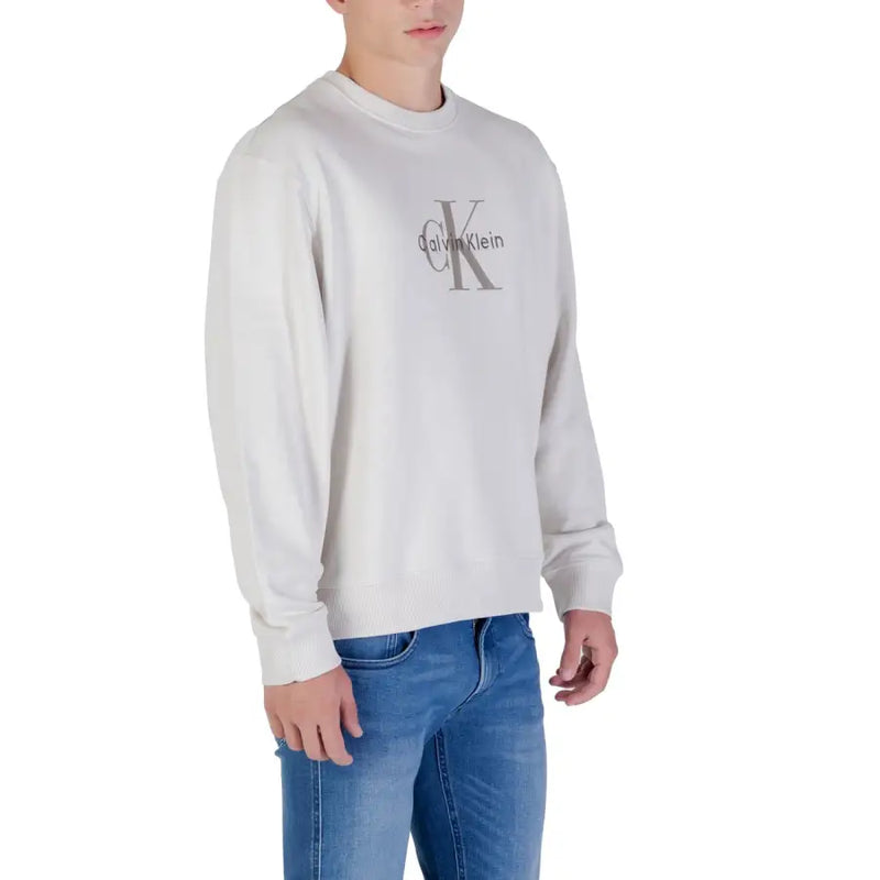 Men’s light gray Calvin Klein Jeans long sleeve crewneck sweatshirt with faint logo