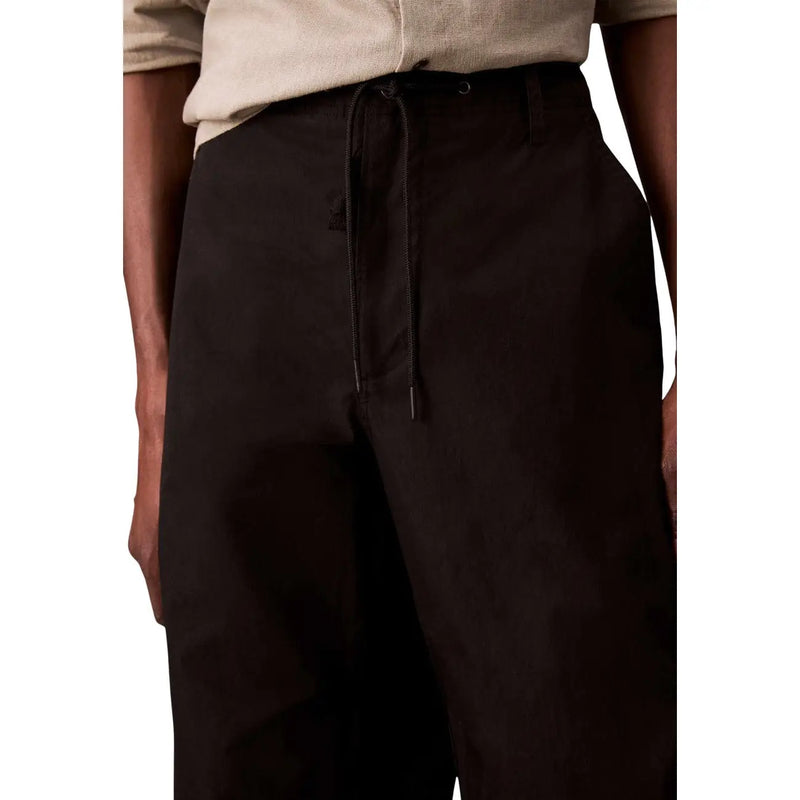 Calvin Klein Jeans men black cotton nylon trousers with drawstring waist and relaxed fit subtle texture