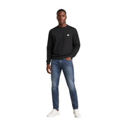Calvin Klein Jeans men black cotton long-sleeved crewneck sweatshirt with a small white logo on the left chest