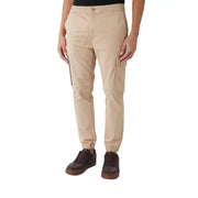Beige cargo pants with elastic waistband drawstring side pockets and cuffed ankles in calvin klein jeans fall winter cotton blend trousers