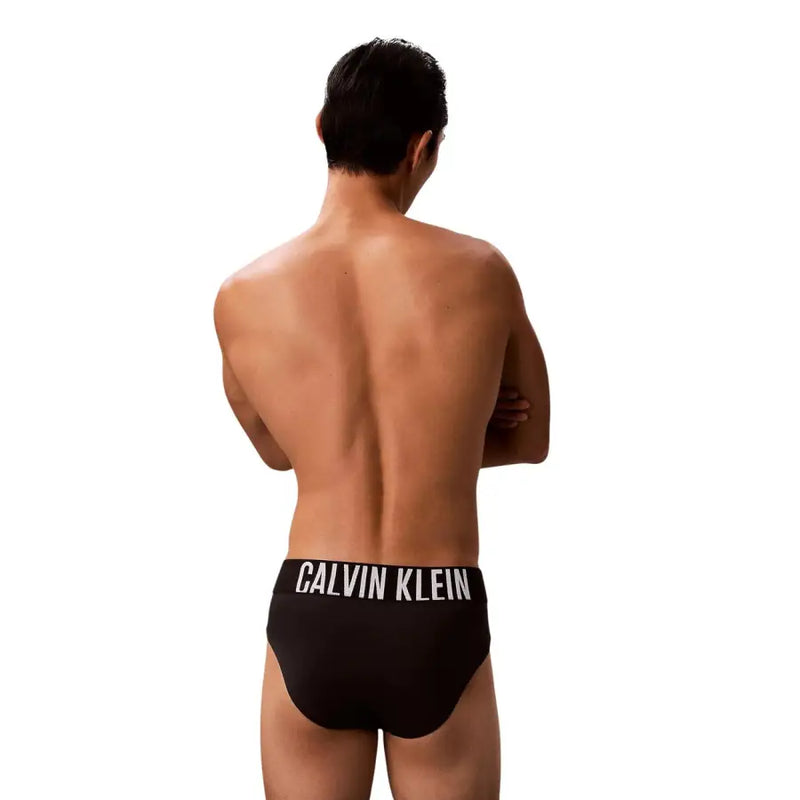 Calvin klein jeans men black swimwear polypropylene briefs with white logo band front view