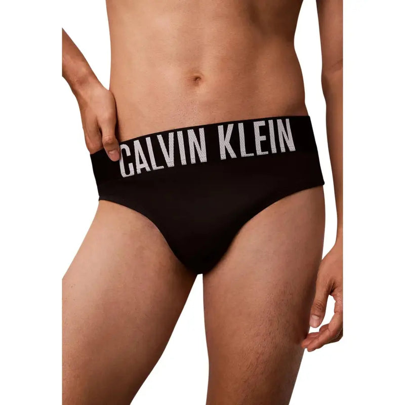 Black calvin klein jeans men swimwear polypropylene briefs with bold white logo band on the waistband