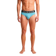 Light blue Calvin Klein briefs with black waistband and white logo in polypropylene designed as men’s swimwear