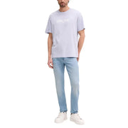 Light lavender Calvin Klein cotton t-shirt with white logo print paired with blue regular fit denim jeans