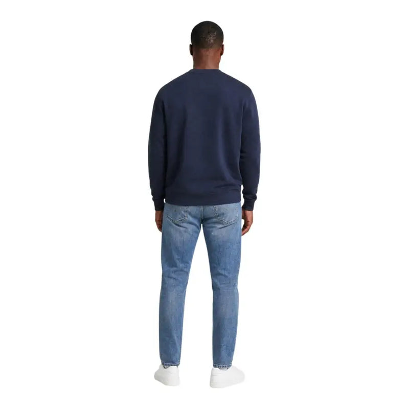 Calvin klein jeans men blue cotton crewneck sweatshirt paired with light-wash denim jeans for casual wear