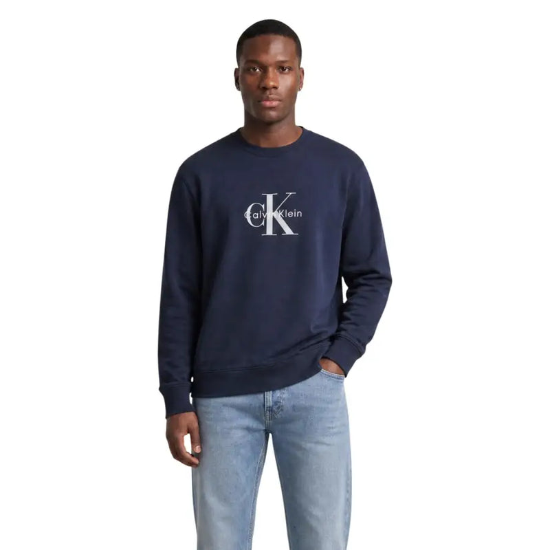 Navy blue Calvin Klein Jeans men cotton round neck sweatshirt with white CK logo on the chest
