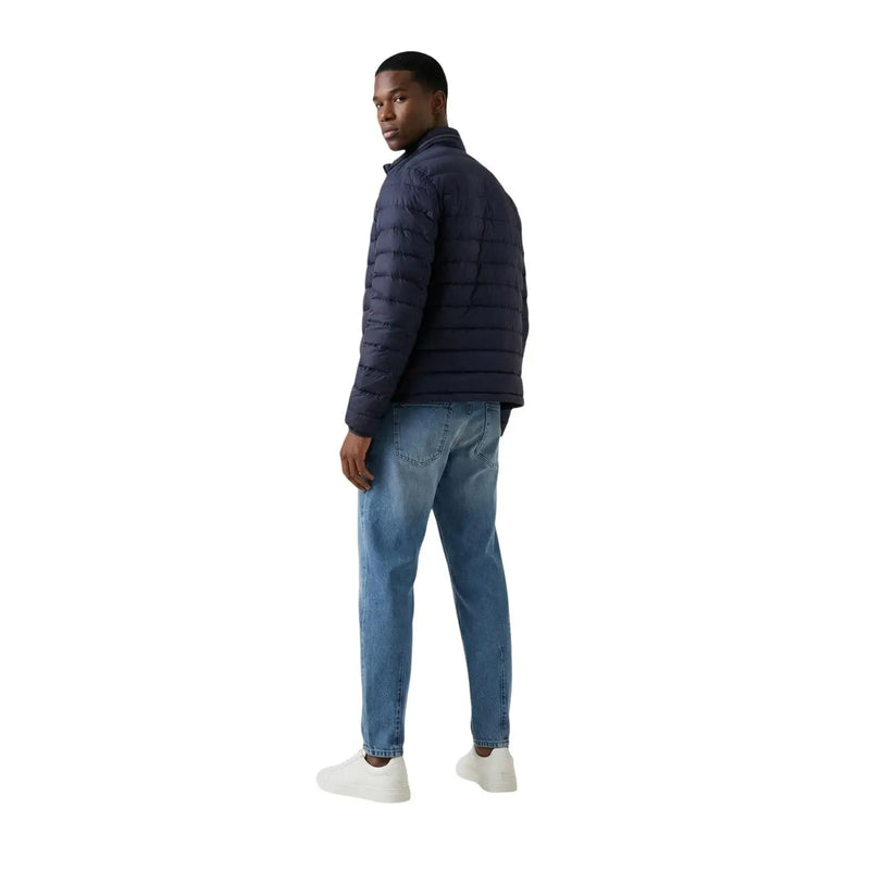 Navy blue quilted polyester Calvin Klein Jeans men zip puffer jacket in size L shown from the back side
