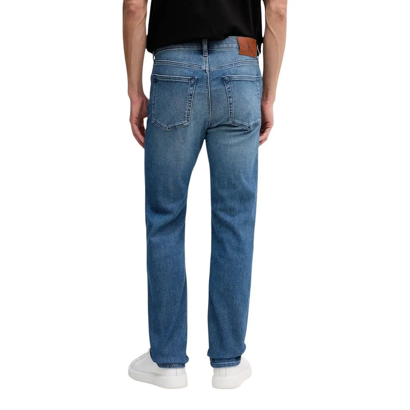 Back view of calvin klein jeans men blue cotton denim jeans with straight-leg cut and brown leather brand patch