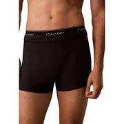 Calvin Klein Jeans Maillot de bain homme noir à double ceinture, composé d'un boxer noir avec logo blanc.