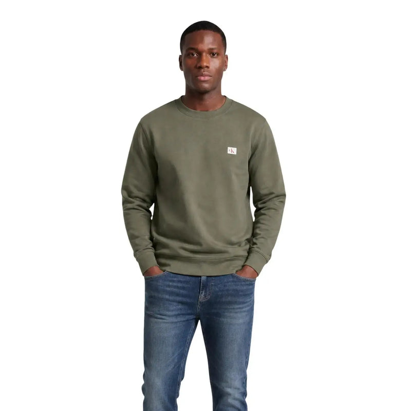 Calvin Klein Jeans men green cotton crewneck sweatshirt with a small white logo patch on the left chest