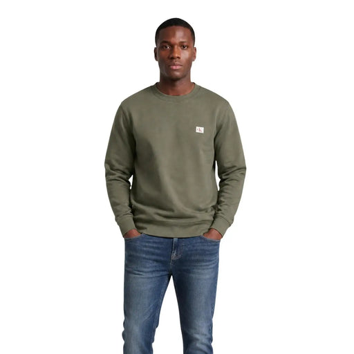 Calvin Klein Jeans men green cotton crewneck sweatshirt with a small white logo patch on the left chest