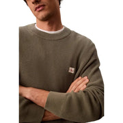 Calvin Klein Jeans Herren grüner Baumwollpullover mit Waffelstrick, klassischer olivgrüner Rautenstruktur und Brustlogo