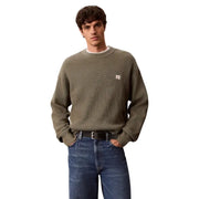 Calvin Klein Jeans Herren grüner Baumwollpullover mit Waffelstrickmuster, strukturierter Strickstruktur und kleinem Markenlabel auf der Brust